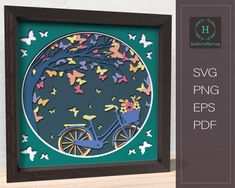 the paper cut art is displayed in a frame with butterflies on it and an image of a