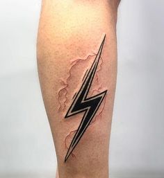 a man's leg with a lightning tattoo on it