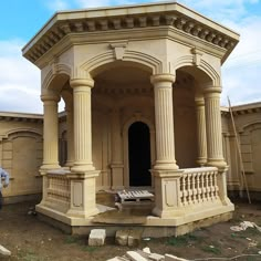 a man standing in front of an old building with columns and pillars on the side