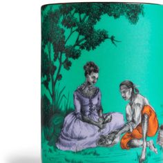 a green mug with two women sitting on the ground