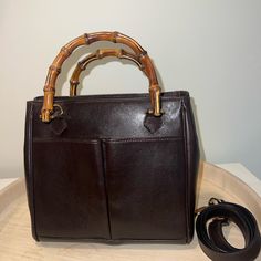 Gucci Bamboo Crossbody Mini Handbag Chocolate Brown Leather Classic Gucci Bamboo Bag, With A Crossbody Strap In A Mini Size. She Has Two Open Front Pockets, And A Zipper Pocket Inside. Authentic. In Excellent Condition. Rarely Used. Measures Approximately 8.5"X7.5"X4.5". From A Smoke Free Pet Free Home. Questions? Leave A Comment Below. Gucci Crossbody Bag Bamboo, Gucci Bamboo Bag, Gucci Mini, Bamboo Bag, Gucci Bamboo, Mini Handbag, Chocolate Color, Mini Handbags, Mini Crossbody