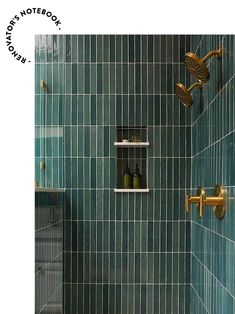 a green tiled shower with gold fixtures and soap dispensers on the wall