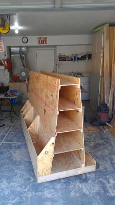 an unfinished shelf in the middle of a garage