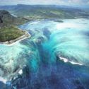 an aerial view of the ocean and land