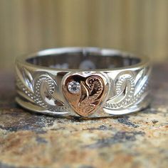 a wedding ring with two hearts on it