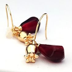 This Listing is for a pair of beautiful juicy Ruby Red Pomegranate Seed and Pomegranate Flower Earrings.  There is an Option for optional Birthstone and or Initital Charm. Matching Necklaces available These earrings are made up from a Handmade Handcrafted Acrylic Pomegranate Seed and 18carat Gold Plated Brass Pomegranate Flower. These Handcrafted Charms are suspended from High Quality Stainless Steel m Ear Wire This Listing is for a pair of very high quality,  hand crafted Earrings (Matching Nec Dark Academia Gifts, Pomegranate Flower, Pomegranate Earrings, Pomegranate Jewelry, Crafted Earrings, Fruit Necklace, Judaica Jewelry, Earrings Matching, Easter Presents