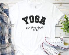 *please note: apparel brand may differ from picture*Yoga lover shirt The adult t-shirt is a unisex shirt hence it will have a looser fit. The order needs to be made individually Select the size , add to cart and then return to this page and order another one again please check the size chart in the photos section and choose the one that fit best. In case of doubt, choose a size up Please note that it will take 3-7 business days for me to process the order and another 3 to 5 business days to deli Sporty Yoga T-shirt With Letter Print, Comfortable Pre-shrunk Workout T-shirt, Comfortable Gym T-shirt With Letter Print, Sporty Letter Print Tops For Yoga, Cotton Activewear With Letter Print For Yoga, Comfortable Athleisure T-shirt With Letter Print, Cotton Letter Print Activewear For Yoga, Comfortable Athleisure Letter Print T-shirt, Athleisure T-shirt With Letter Print And Comfortable Fit