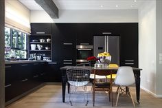 the kitchen is clean and ready to be used as a dining room or family room