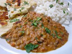 a white plate topped with rice and beans