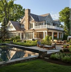 a large house with a pool in front of it