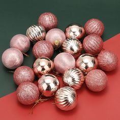 a bunch of shiny pink and silver ornaments