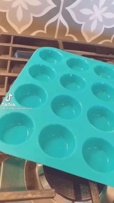 a blue tray that has some cupcakes in it