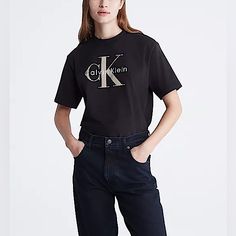 Women’s Calvin Klein Graphic Tee. Size:Medium Nwot Cut In A Boxy Fit, This T-Shirt Features A Ck Monogram Logo Design At The Front. Made With A Crewneck And Crafted From 100% Cotton For Comfortable Wear. Only Defect Is The Logo Has Black Writing On It & The Side Of The Shirt Has A Slit Hole. Measurements: Pit To Pit: 22” Shoulder To Hem: 25” Model Is 5'9" Wearing A Size S Final Sale / No Returns Calvin Klein Tshirt, Ck Monogram, White Calvin Klein, Ck Calvin Klein, Calvin Klein Shorts, Black Writing, Monogram Logo Design, Crew Neck Tshirt, Crop Top Shirts