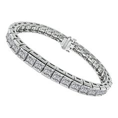 This is a stunning platinum bracelet. The bracelet is set with sparkling princess cut diamonds that weigh approximately 22.00ct. The color of these diamonds is F-G with VVS1-VVS2 clarity. The bracelet measures 7 inches in length and 7mm in width. The bracelet weighs 43.8 grams. Inventory #59900AWSSS Platinum Bracelet, Princess Cut Diamonds, Tennis Bracelet, Princess Cut, Diamond Cuts, Platinum, Jewelry Bracelets, Diamonds, Sparkle