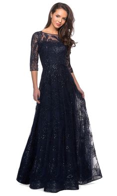 Fall in love with the sheer romance of this La Femme 27942 creation. Flaunting a beautiful floral design on a sheer lace overlay, this dress flaunts an illusion bateau neckline with sheer quarter sleeves. Ornamented with sequins, this dazzling piece also shows a sheer full back with a zipper closure. An A-line silhouette skirt charms this ensemble. Explore a whole new kind of sophistication in this La Femme masterpiece. Mother Of Groom Dress, Lace A Line Dress, Illusion Dress, Sequin Gown, Full Length Dress, Lace Dress Long, Bateau Neckline, A Line Gown, Bride Style