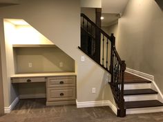 an empty room with stairs and desks