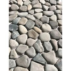 rocks are arranged on the ground to create a pattern in this photo, which looks like it is made out of stones