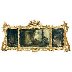 an ornate gold frame with paintings on it