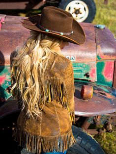 Great pricing on this beautiful coat, originally $1898. The perfect jacket and perfect finish to any western outfit. Our Jessie Fringe Jacket was created with careful placement of fringe and pockets. Loaded with hand stitching, our Italian leather has and amazing attention to detail. Fun to wear, and a true Wild West Statement! Fine distressed Italian leather in camel, taupe and tan, and chocolate. We do stock inventory, but please allow 4 weeks, in case we are in production, contact if you are Bohemian Fringe Outerwear For Rodeo, Western Leather Jacket With Fringe For Winter, Bohemian Winter Outerwear With Beaded Fringe, Rodeo Outerwear With Tassels, Long Sleeve Outerwear With Tassels For Rodeo, Western Style Fringe Outerwear For Rodeo, Western Brown Leather Jacket For Rodeo, Fitted Outerwear With Beaded Fringe For Fall, Western Tassel Outerwear For Fall