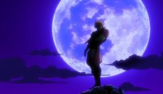 a man standing on top of a rock in front of a full moon