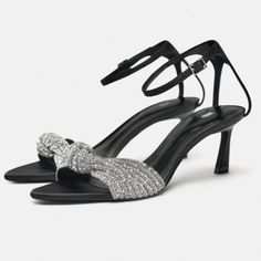 New With Tags Size 6.5 Mid-Height Heeled Fabric Sandals With Rhinestones. Front Knot Detail. Buckled Ankle Strap Closure. Heel Height: 2.4 Inches (6 Cm) Black | 1304/310 Sold Out Composition Upper 100% Polyester Lining 60% Polyurethane 40% Goat Leather Binm Glamorous Summer Sandals For Dinner, Sparkling Low Heel Sandals For Party, Silver Sandals With Rhinestones For Events, Evening Party Sandals With Rhinestones, Glamorous Ankle Strap Sandals For Dinner, Silver Rhinestone Event Sandals, Bedazzled Ankle Strap Sandals For Party, Evening Open Toe Heels With Rhinestones, Evening Open Toe Rhinestone Heels