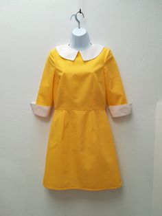 "ASHLEY DRESS Handmade dress 35%Cotton 65%Polyester Colors: yellow, white This dress is made under request, so there is no stock. Since is only made under request, can not be returned ( read my policies concerning conditions for exchanges or returns) CAN I CHANGE THE COLOR? YES Just add to your cart the listing special request, aswell for lining or other changes as alterations https://www.etsy.com/uk/listing/624364219/special-requests?ref=shop_home_active_1&frs=1 ARE YOU ON A RUSH? Do you ne Yellow Fitted Mod Dress, Collared Yellow Dress For Work, Yellow Cotton Retro Vintage Dress, Yellow A-line Retro Dress, Mondrian Dress, Mod Shift Dress, 60s Mini Dress, Mod Dress 60s, 1960s Mod