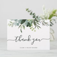 a thank card with greenery on it