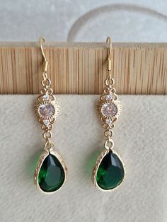 FOR END OF YEAR ORDERS (CHRISTMAS GIFTS) RETURNS ARE ACCEPTED UNTIL JANUARY 15. Good morning, Emerald green art deco earrings, 1920s style earrings, Bridal earrings, gold zircon earrings Earrings made of 14 and 18 carat gold (3 layers). Emerald green drop crystal Zircons Length of pendants: 4 cm Bridal earrings, crystal earrings, art deco style earrings, reception earrings, gold earrings, bridesmaid earrings, ceremony earrings, gift for her. Gold and blue bridal earrings, Gold crystal earrings, Elegant Green Round Bridal Earrings, Green Art Deco Drop Earrings, Vintage Emerald Earrings For Anniversary, Art Deco Green Jewelry For Pierced Ears, Pierced Emerald Jewelry For Wedding, Ornate Green Jewelry For Evening, Art Deco Drop Earrings For Anniversary, Green Filigree Earrings For Formal Occasions, Gold Emerald Earrings For Evening