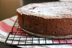 a chocolate cake sitting on top of a cooling rack