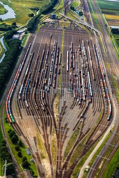 an aerial view of a train yard in the country