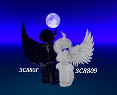 two white angel figurines standing next to each other in front of a full moon