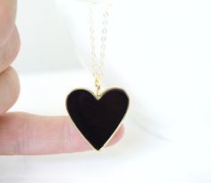 "Large Heart Necklace Pendant Anniversary Valentine's Day Your love Gift for Mom Gift for wife **This listing is for the large heart Necklace in blue or black, the model in the listing is wearing the small heart, here is the listing for the small heart necklace in blue https://www.etsy.com/listing/1014800174/gold-heart-necklace-robin-egg-blue?ref=shop_home_feat_5&pro=1 -Details Heart - 1.25\" or 28mm, approx brass and robin egg blue enamel, the back is gold and blank, not double sided Chain Black Necklace For Valentine's Day Gift, Black Heart-shaped Everyday Jewelry, Black Heart Pendant Necklace Gift, Black Heart Pendant Necklace As Gift, Black Heart Pendant Necklace For Gift, Black Charm Necklace For Valentine's Day Gift, Black Charm Necklaces As Gift, Everyday Black Heart-shaped Jewelry, Valentine's Day Gift Black Charm Necklace