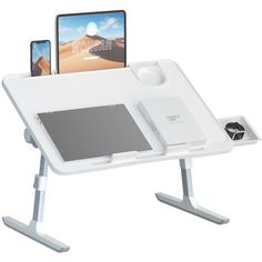 a white desk with two cell phones and a tablet on it's top shelf