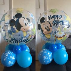 two mickey mouse balloons on top of each other