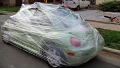 a car wrapped in plastic on the street