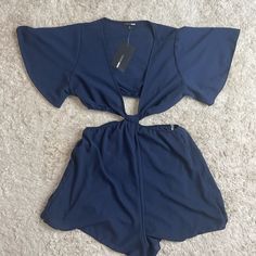 New With Tags This Is A Two Piece Romper That Connects In The Front Navy Blue Size Medium Inventory #0957 Check Out My Poshmark Closet Https://Posh.Mk/Asolupgmdzb Reasonable Offers Are Always Welcomed & Appreciated Save An Additional 15% When You Bundle 3 Or More Items! Friendly Home! Free Home! Fast Shipping Thank You For Visiting Or Shopping My Closet! Chic Short Blue Tops, Blue Short Sleeve Jumpsuit For Night Out, Blue Short Sleeve Jumpsuits And Rompers For Night Out, Blue Wide-leg Jumpsuits And Rompers For Day Out, Blue Casual One-piece Jumpsuits And Rompers, Trendy Blue Wide-leg Jumpsuits And Rompers, Denim Blue Stretch High-waist Jumpsuits And Rompers, Two Piece Romper, Black Lace Jumpsuit