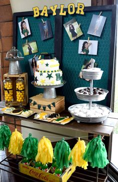 a table topped with lots of cakes and desserts