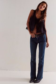 So sleek with Western-inspired flair, these jeans from our We The Free collection will turn heads with every wear. **Fit:** Mid-rise, slim flare fit **Features:** Zip fly and button closure, four-pocket design, flattering seaming throughout, soft stretch denim **Why We ❤ It:** Classic with pointed boots or off-duty with sneakers, this pair has endless ways to wear. | We The Free Ashland Flare Jeans at Free People in Dark Wash, Size: 25 Straight Flare Jeans Outfit, Nashville Jeans Outfit, Flare Bootcut Jeans Outfit, Flare Jeans Outfit Going Out, Fall Bar Outfits Going Out, Jeans Tucked Into Cowboy Boots, Jeans With Booties Outfits, Jeans With Boots Outfit, Boots With Jeans Outfit