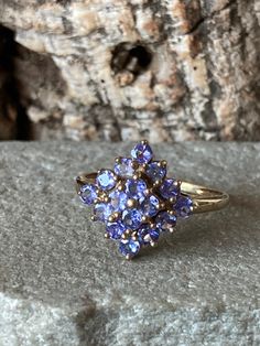 A wonderful Tanzanite ring, unusual diamond shaped cluster top, 16 pretty Tanzanite stones 2.5mm , overall size 15mm point to point in 9ct Gold , Size P1/2 or US 7.75 Garnet Drop Earrings, Tanzanite Stone, Tanzanite Ring, Silver Engraving, Amethyst Earrings, Diamond Shaped, Silver Bangles, Amethyst Ring, Cluster Ring