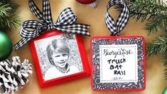 two christmas ornaments are hanging on a table