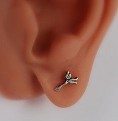 "Fower earrings in Sterling silver with stem and two flowers. I made for you here a cute delicate flower earring, post or French wire earrings. The Lily represents purity and fertility. The sweet and innocent beauty of the lily flower has given it the association of fresh life and rebirth. Flower length 1/2\" French wires make it 5/8\" long Dangle also available also on ear wire. Ear cuff in my shop also. https://www.etsy.com/listing/123620420/cartilage-flower-cuff-pierced-lily? I do this flower Tiny Sterling Silver Flower Earrings As Gift, Dainty Sterling Silver Single Flower Earring, Delicate Tiny Flower Earrings For Gift, Delicate Single Flower Earring For Gifts, Cute Silver Flower Shaped Earrings, Delicate Single Flower Earring As Gift, Cute Nickel-free Silver Flower Earrings, Cute Hypoallergenic Silver Flower Earrings, Cute Silver Flower Earrings As Gift