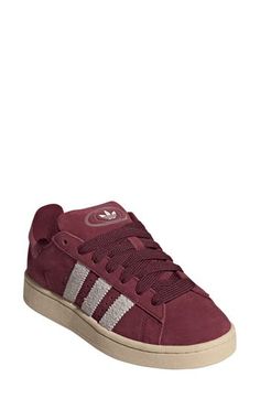 Serrated 3-Stripes and matching Trefoils stand out on this suede sneaker featuring extrasoft cushioning on the tongue and cuff for a skate-inspired twist. Lace-up style Leather or leather and textile upper/textile lining/rubber sole Imported Dark Red Shoes, Maroon Shoes, Adidas Campus 00s, Burgundy Shoes, Adidas Campus, Red Sneakers, Red Stripe, Suede Sneakers, Red Shoes