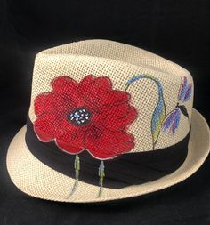 Red Poppy Design hand-painted, short brim Fedora in the classic Trilby style. Made with a straw & paper braid and hard shaped (non-crushable). Acrylic paints used in artwork will not bleed if wet. See image in pictures section for sizing instructions.   NOTE:  BLACK ONLY AVAILABLE IN LARGE. Will include foam sizer to reduce hat size. Please allow for delivery times of 5-12 days as these are painted to order.  No returns or exchanges but please contact me if there are any issue. Thanks much   Enj Red Straw Hat For Spring, Artistic Fedora With Short Brim For Spring, Spring Hand Painted Adjustable Fedora, Red Summer Hat For Country Events, Red Hats For Country Events In Summer, Red Hat For Country Events In Summer, Hand Painted Brimmed Straw Hat For Spring, Artistic Straw Hat With Curved Brim For Spring, Artistic Brimmed Fedora For Spring