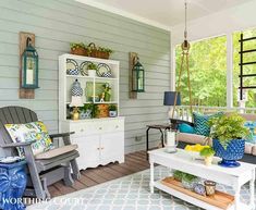 a living room filled with lots of furniture and decor on top of a wooden floor