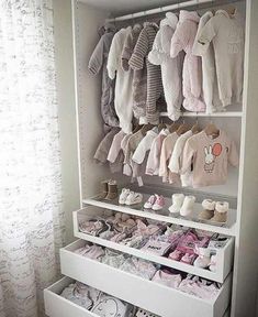 an image of a baby's closet with clothes and shoes on display in it