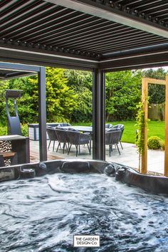 a large hot tub sitting in the middle of a patio