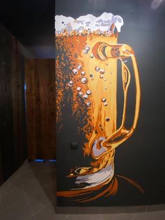 a painting of a beer mug with bubbles on the bottom is shown in front of a black wall