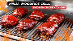 some meat is cooking on a grill with the words ninja woodfire grill smoked chicken thighs