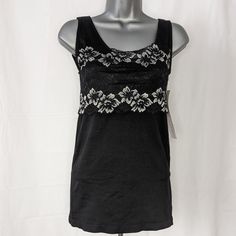 This Rhonda Shear Black Tank Top Is Perfect For Any Occasion. The Sleeveless Design And Round Neck With Wide Straps Make It Comfortable To Wear With Shelf Bra The Top Is Stretchy, Making It Easy To Move Around, And The Garment Care Is Hassle-Free. Get Ready To Look And Feel Confident With This Beautiful Rhonda Shear Tank Top. Rhonda Shear Black Tank Top Lace Accent Women's Large L S624k Please See Pictures For Details And Measurements. Fitted Black Tank Top With Lace Trim, Black Sleeveless Top With Lace Trim, Casual Black Lace Trim Tank Top, Casual Black Tank Top With Lace Trim, Camisole Bra, Black Tank Top, Lace Tank Top, Shelf Bra, Lace Tank