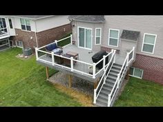 an aerial view of a house with stairs leading up to it